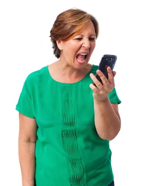 Volwassen vrouw praten via de telefoon — Stockfoto