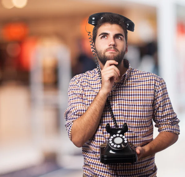 Hombre con teléfono en la cabeza — Foto de Stock