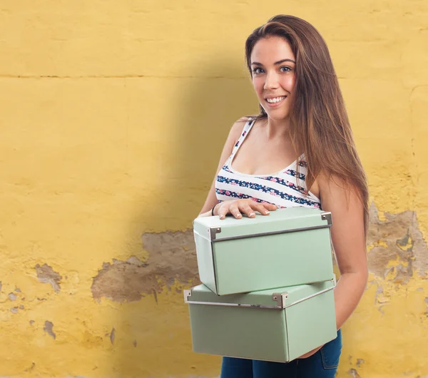Girl holding a vintage boxes — Stock Photo, Image