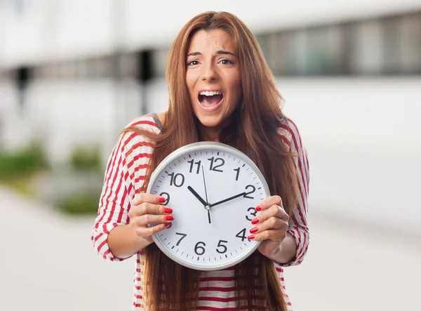 Woman holding a clock — Stock Photo, Image