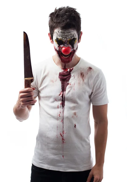 Böser Clown mit Messer Stockbild