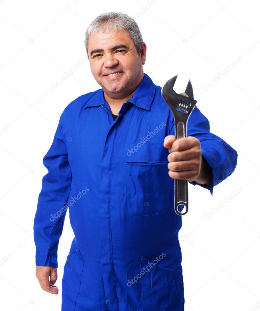 Mechanic holding a monkey wrench