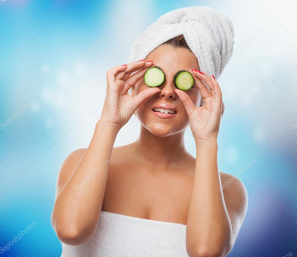 Woman ready to have a cucumber treatment