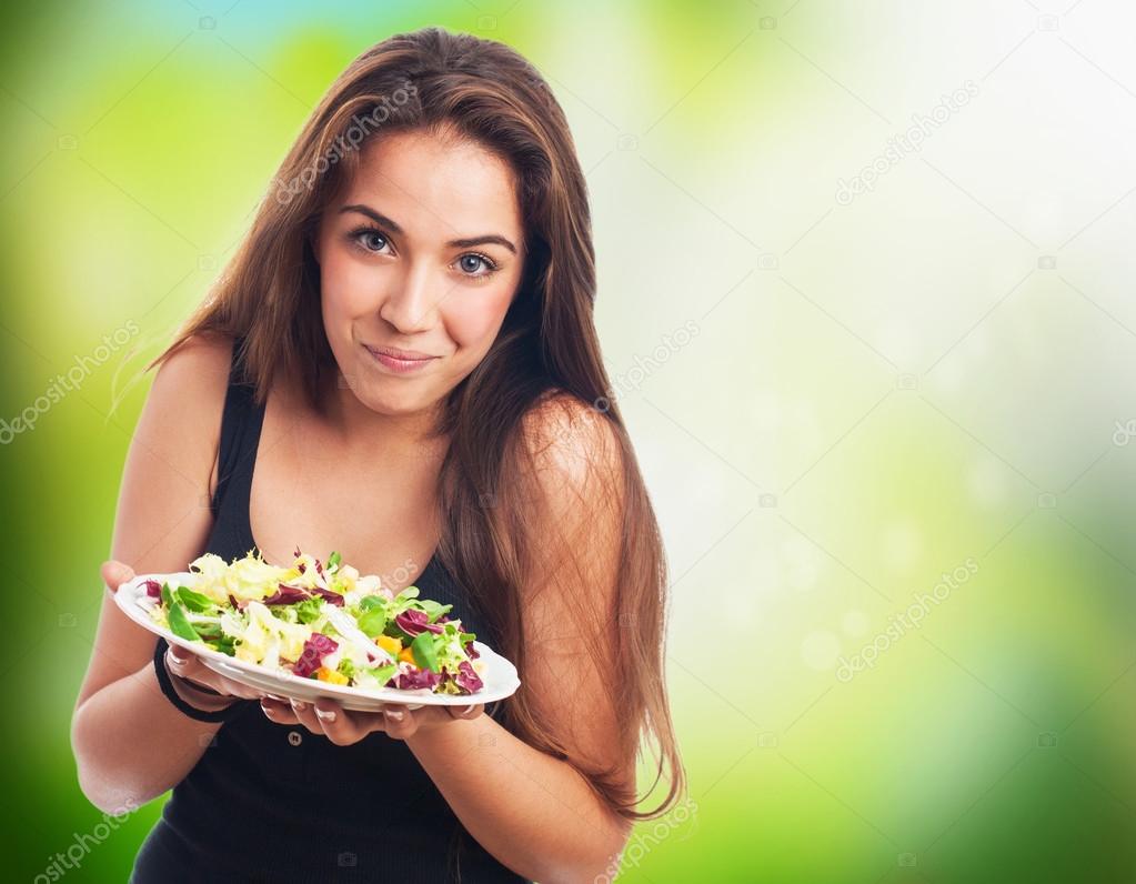 Young woman with a salad