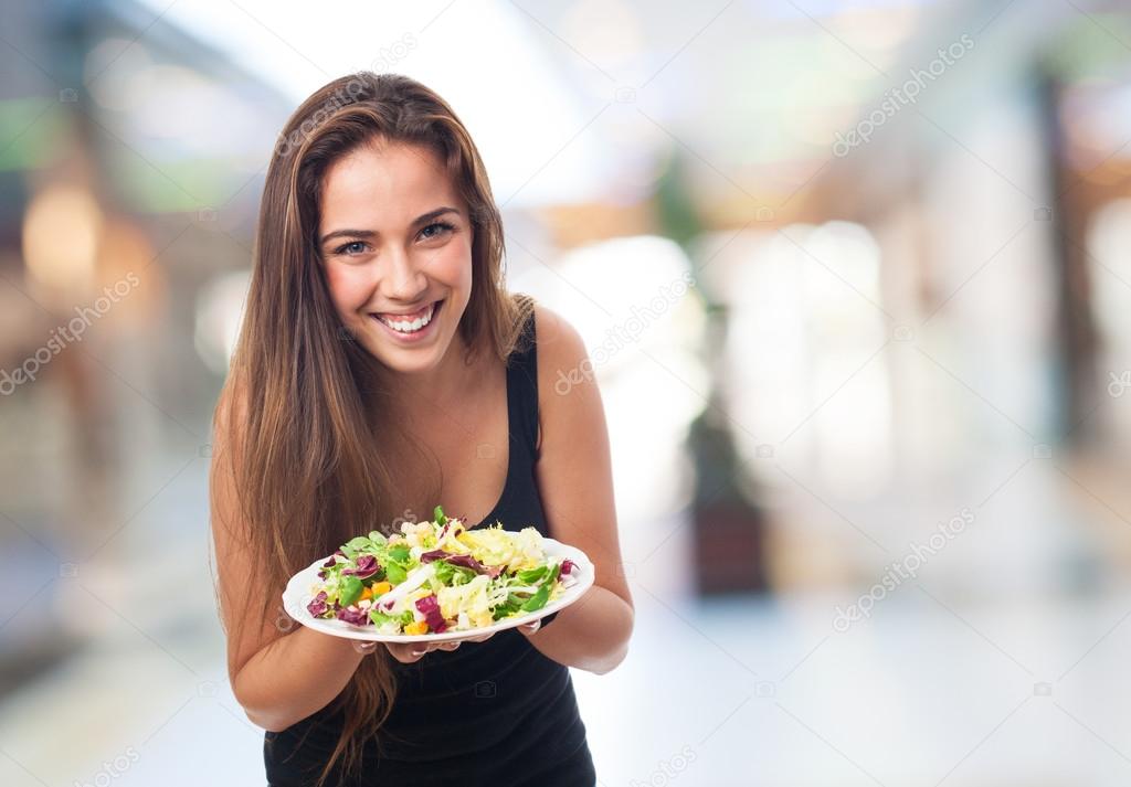 Woman holding a delicious salad