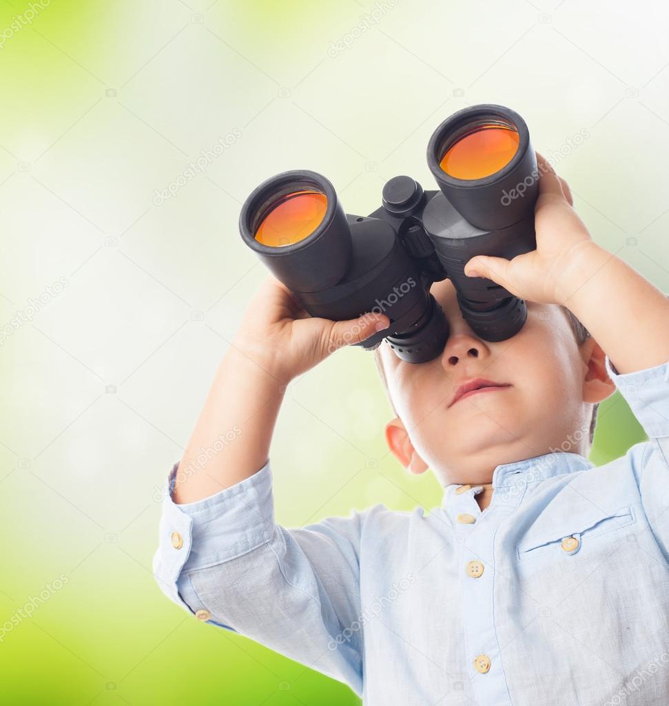 Boy looking through the binoculars