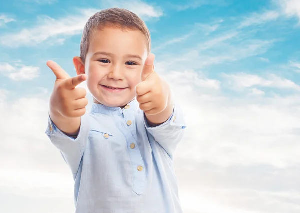 Little boy doing the victory gesture — Stock Photo, Image