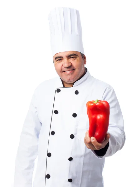 Cuoco uomo in possesso di pepe — Foto Stock