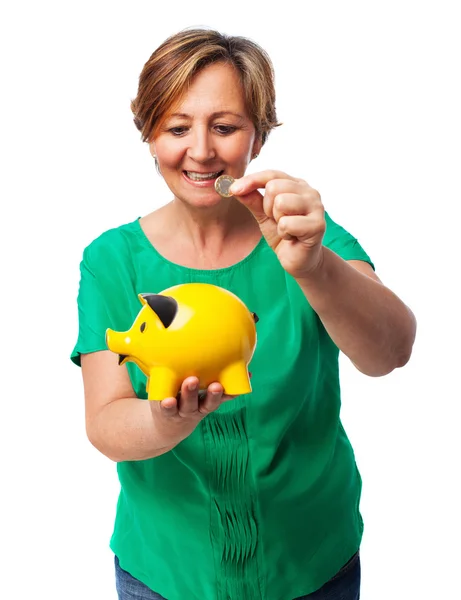 Woman with her piggy bank — Stock Photo, Image