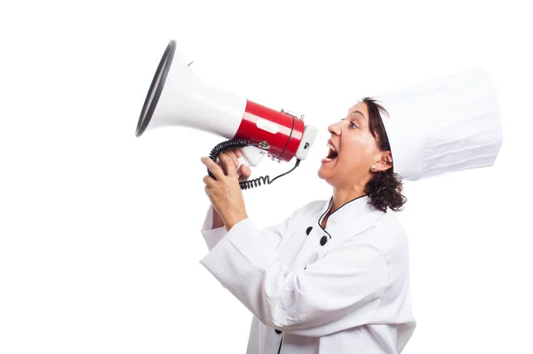 Femme cuisinière criant avec un mégaphone — Photo