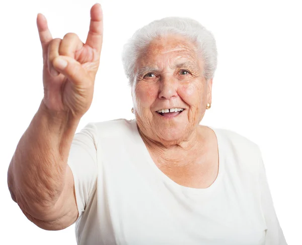 Woman doing a rock gesture — Stock Photo, Image