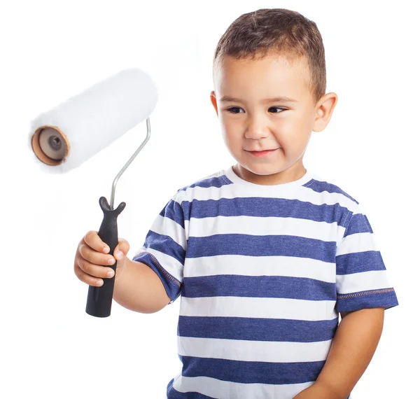 Niño con rodillo blanco — Foto de Stock