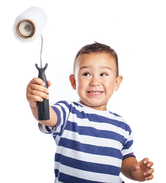 Niño con rodillo blanco — Foto de Stock