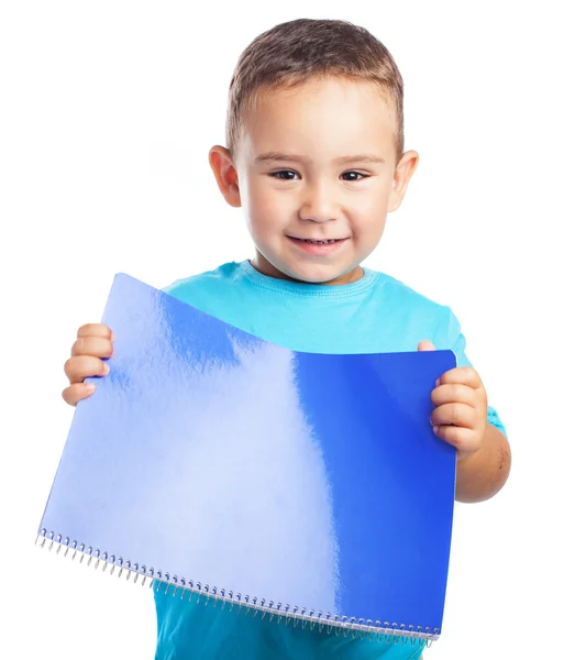 Menino com caderno azul — Fotografia de Stock