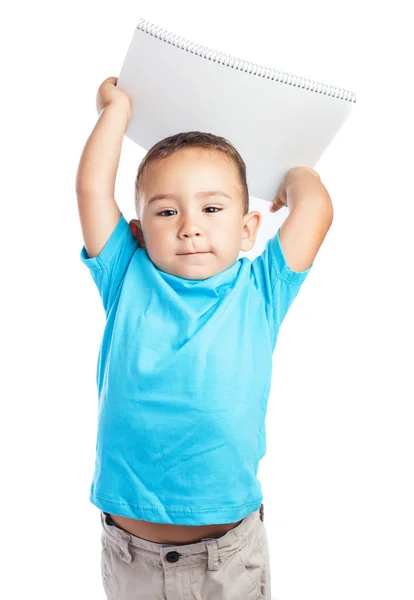 Menino com caderno azul — Fotografia de Stock