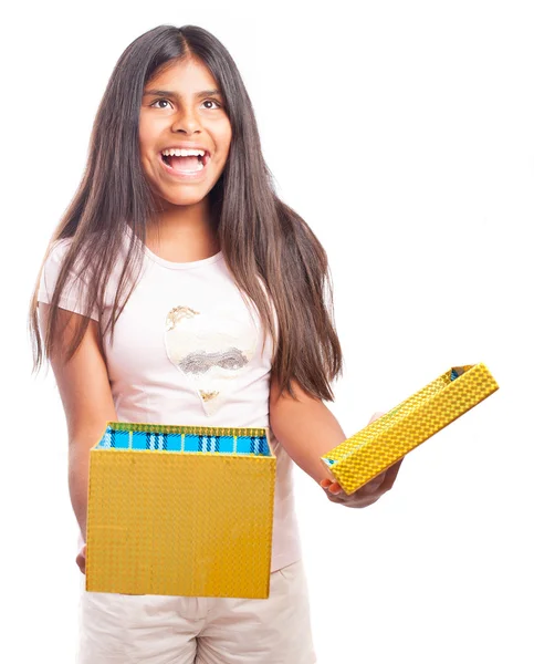 Surprised girl with present — Stockfoto
