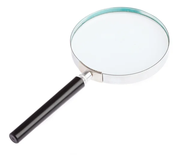 Magnifying glass laying — Stock Photo, Image