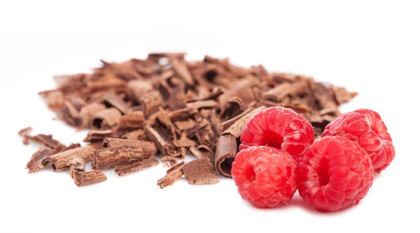 Raspberries with chocolate curls — Stock Photo, Image