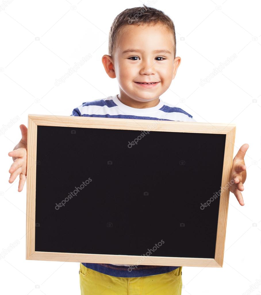 Cute kid holding chalkboard