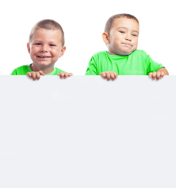 Children behind a billboard — Stock Photo, Image