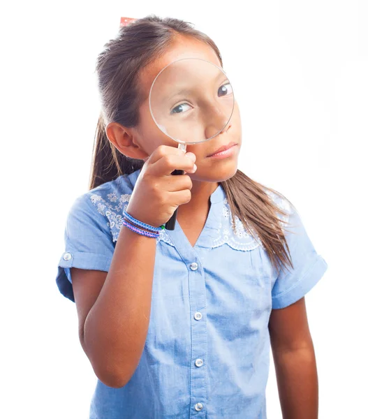 Menina segurando uma lupa — Fotografia de Stock