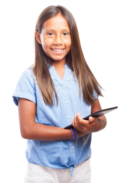 Flicka som håller en tablett — Stockfoto