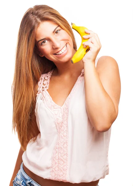 Woman calling with a banana — Stock Photo, Image