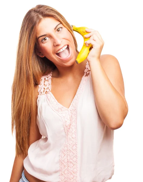 Mujer llamando con un plátano — Foto de Stock