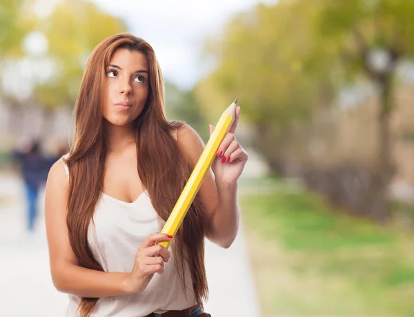 Vrouw met een potlood — Stockfoto