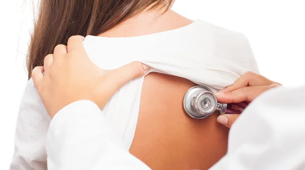 A doctor checking the heart — Stock Photo, Image