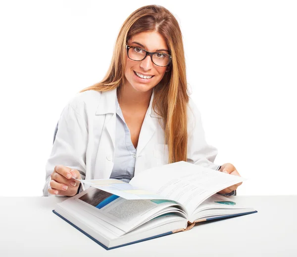 Doctor reading a book — Stock Photo, Image