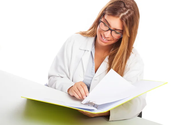 Doctor reading a medical report — Stock Photo, Image