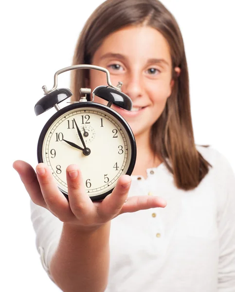 Girl holding an alarm clock — Stock Photo, Image