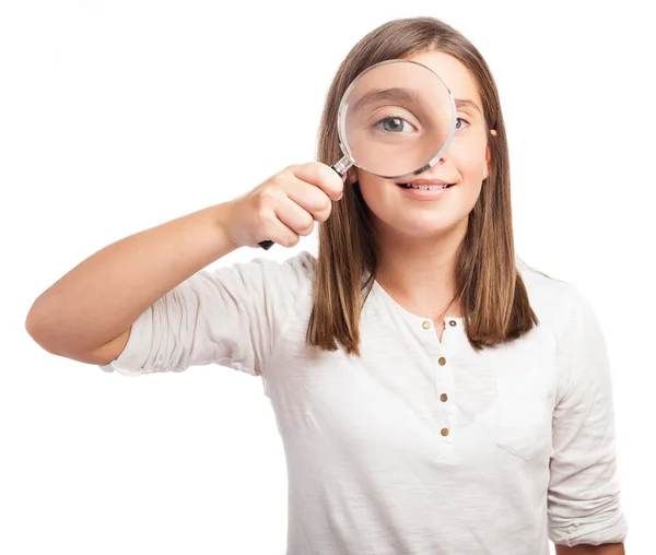 Bir büyüteç gözlük kullanan kız — Stok fotoğraf