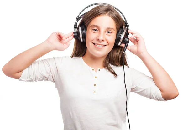 Girl using headphones — Stock Photo, Image