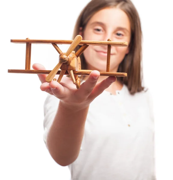 Girl playing with a plane — Stock Photo, Image