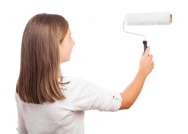 Girl holding a paint roller Stock Picture