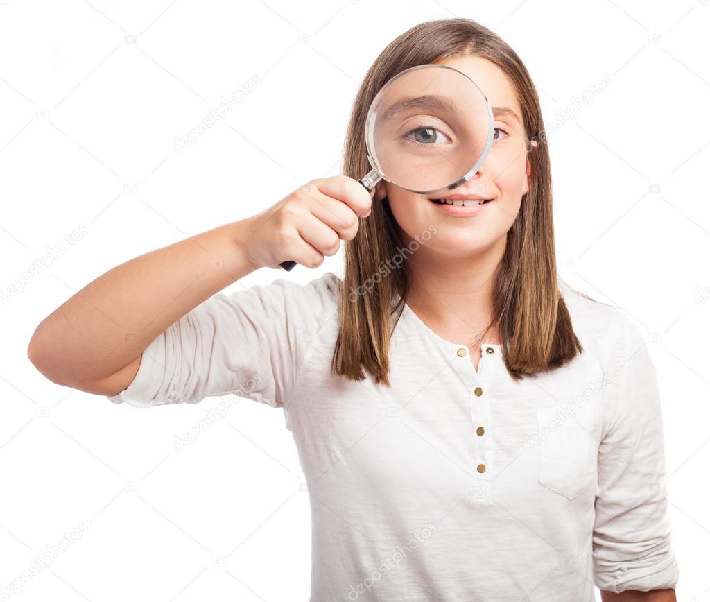 Girl using a magnifying glasses