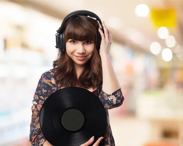 Mulher segurando vynil — Fotografia de Stock