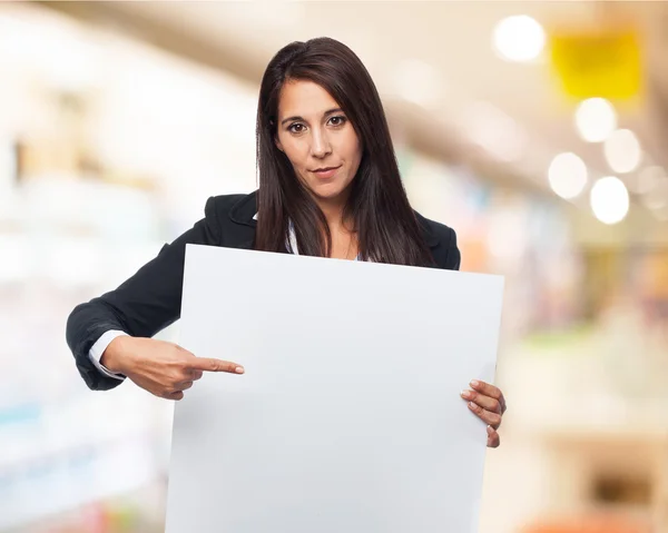 Cool businesswoman with banner — Stock Photo, Image