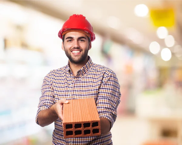Worker man with brick — Stock Photo, Image