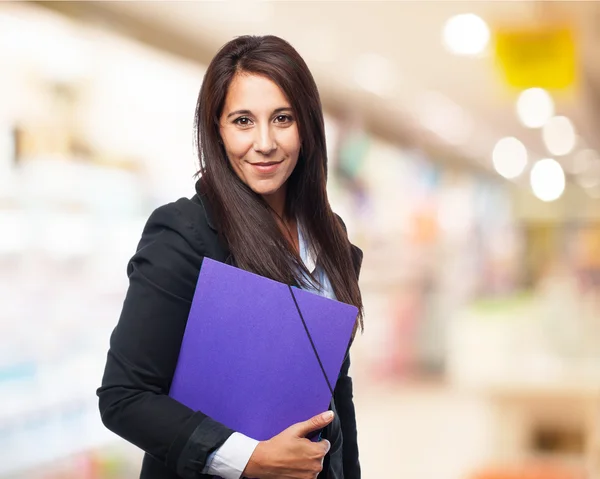 Cool businesswoman with folder — Stock Photo, Image