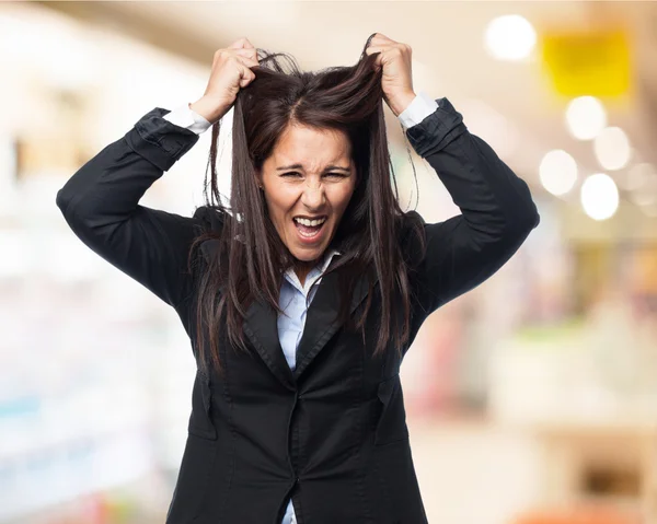 Businesswoman stretches her hair — Stock Photo, Image