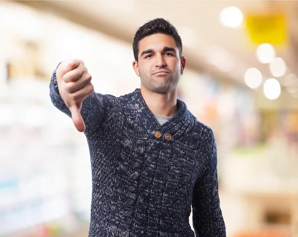 Man with thumb down — Stock Photo, Image