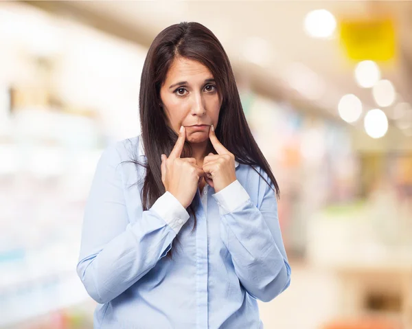 Woman shows sad gesture — Stock Photo, Image