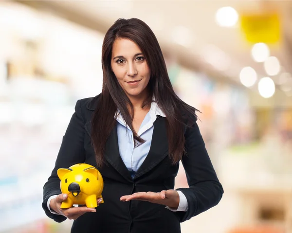 Businesswoman with piggy bank — Stock Photo, Image