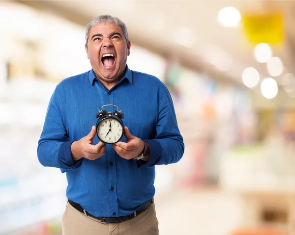 Hombre con despertador — Foto de Stock