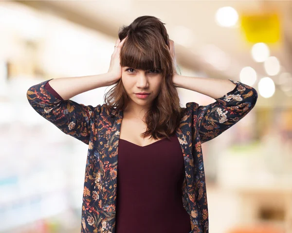 Young woman covering her ears — Stock Photo, Image