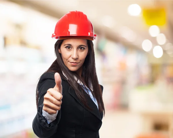 Architect woman shows okay sign — Stock Photo, Image