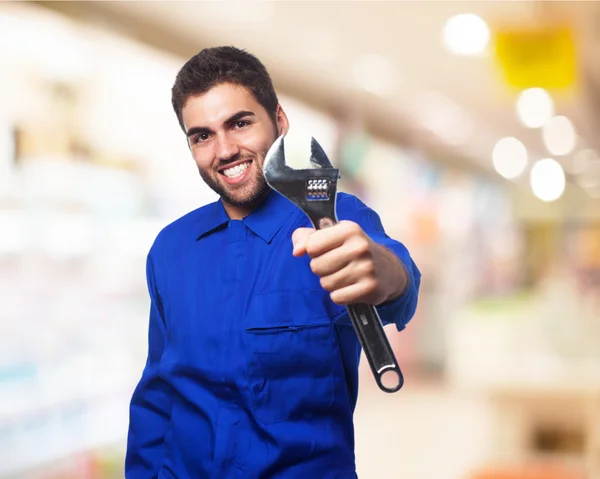 Mechanic man with wrench — Stock Photo, Image